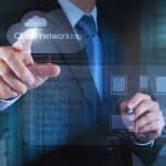 Businessman hand working with a Cloud Computing diagram on the n