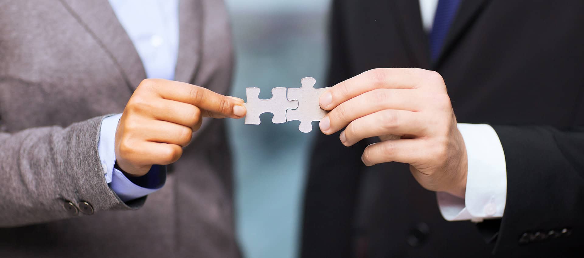 Seamless puzzle pieces fitting together, corporate teamwork, collaboration, business partnership, corporate strategy.