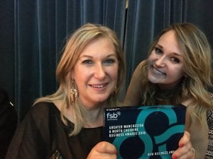 Caroline (left) and Charlotte Weber with the award. Picture by Jason Burg